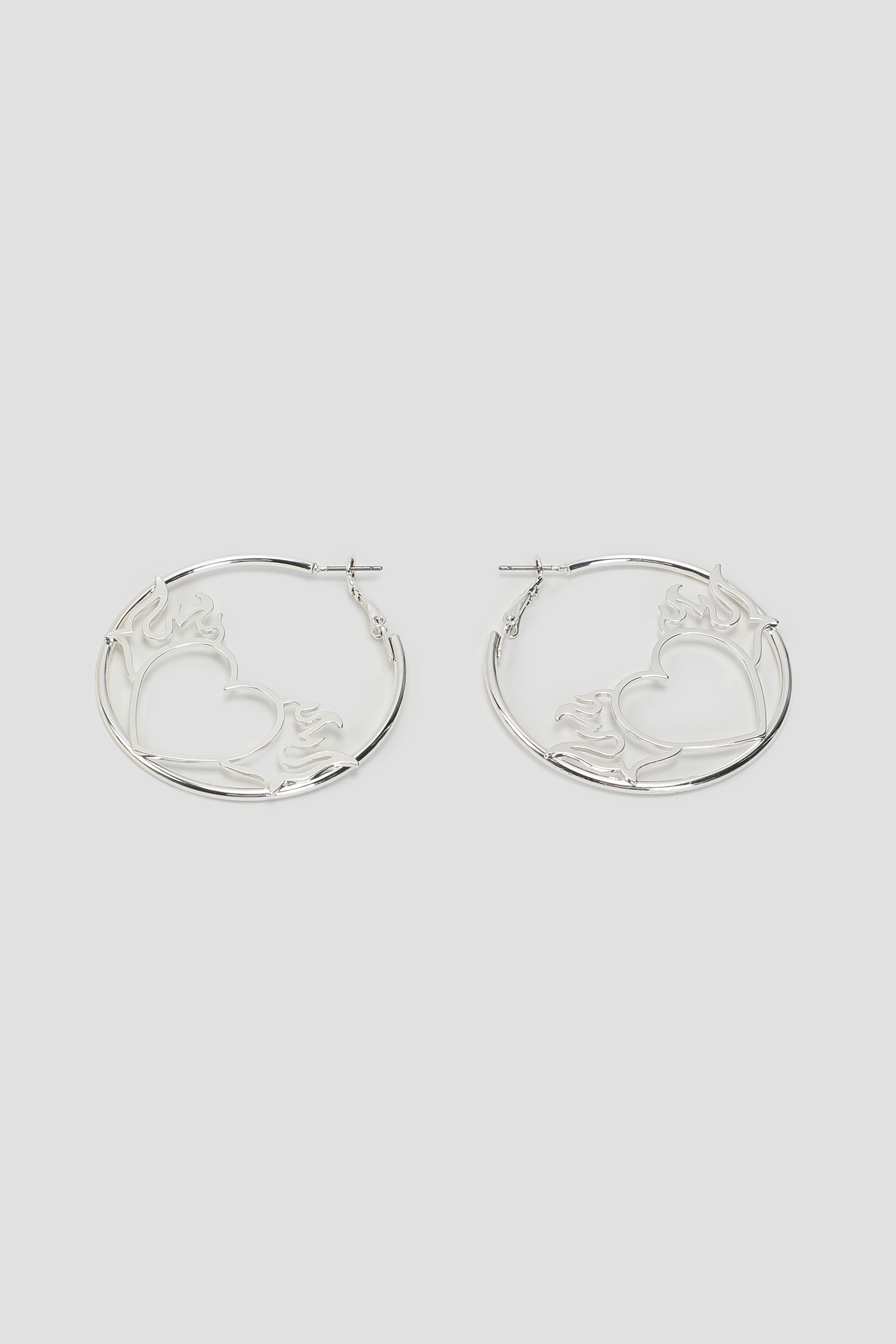 Ardene Flaming Heart Hoop Earrings in Silver | Stainless Steel